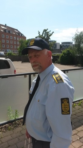 Politibetjent i serien FRIHEDEN, 2018.